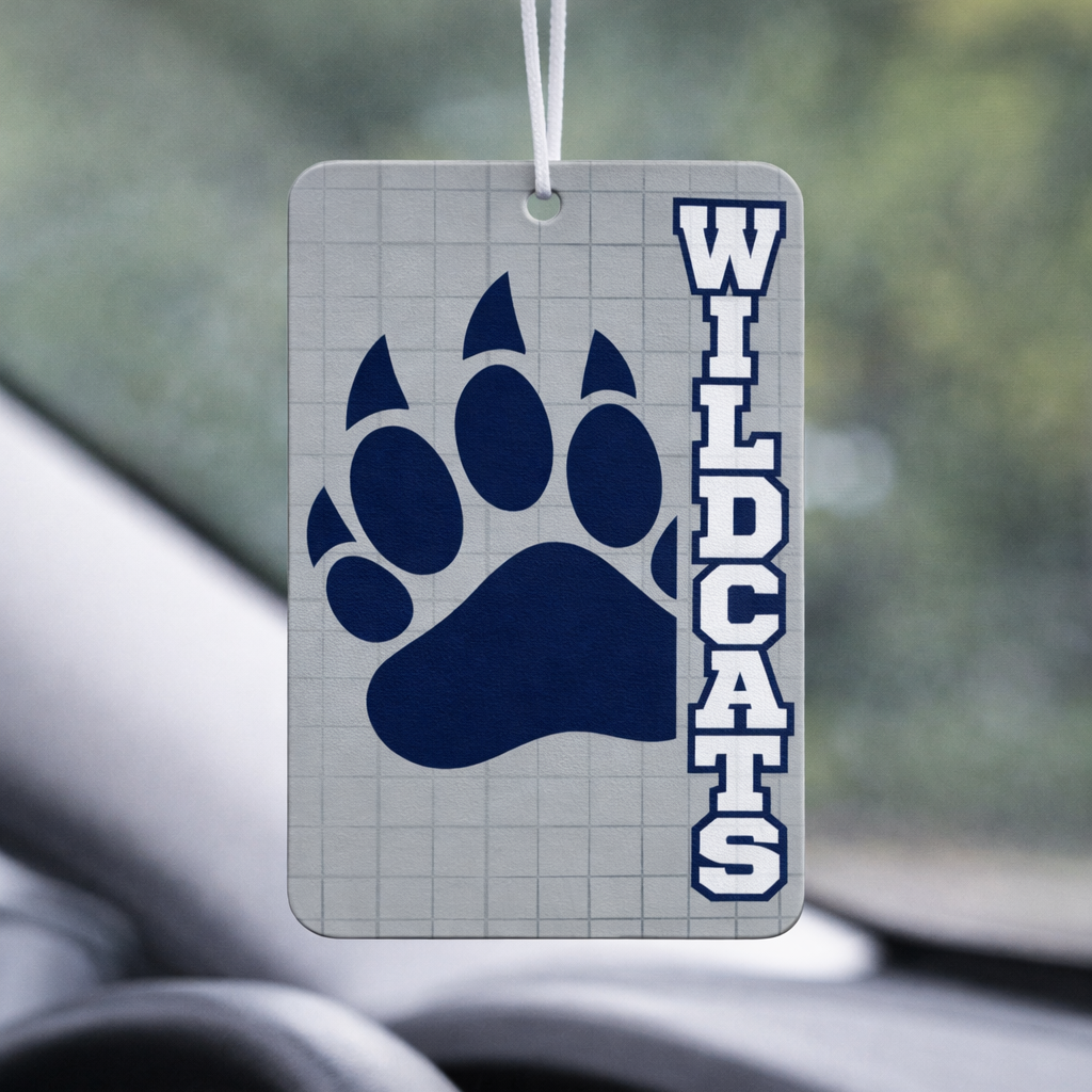 Car air freshener with blue paw print and 'Wildcats' text hanging from a car's rearview mirror.