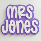 Decorative sign with 'Mrs Jones' text on a white background