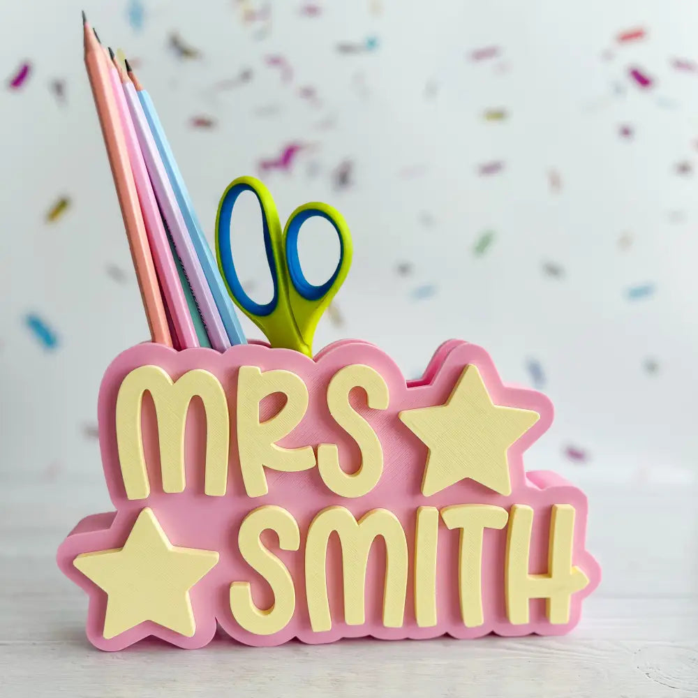 Personalized nameplate with 'Mrs. Smith' and stationery items on a light background